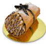 Giant cannoli cake filled with chocolate mini cannoli inside